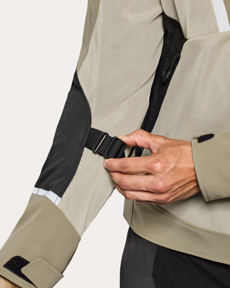 Adjustment strap at lower arm