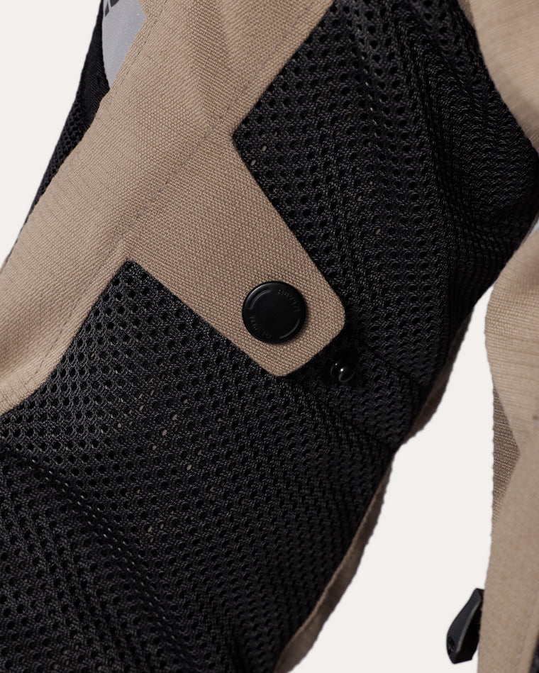 Adjustment tab at upper arm