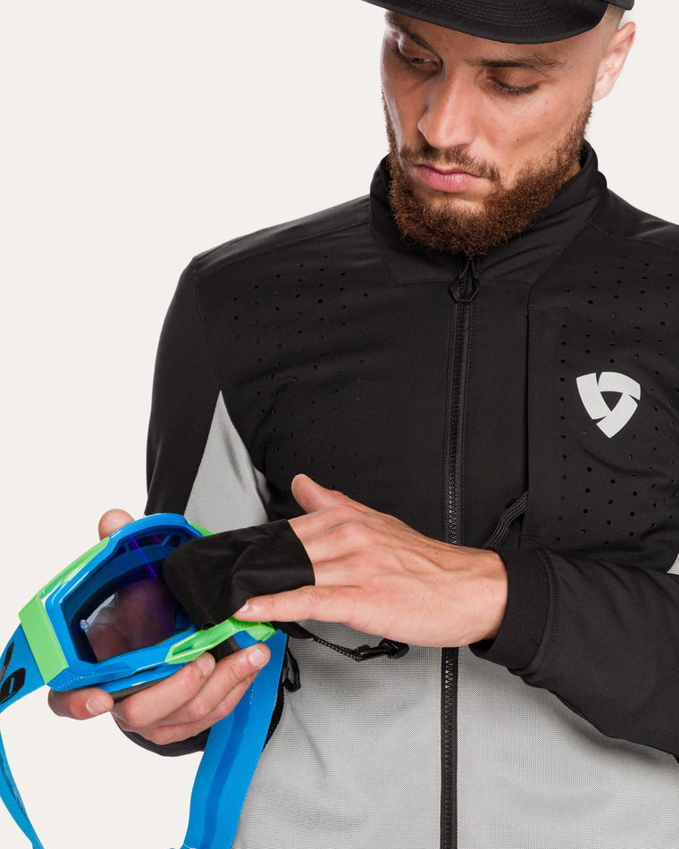 Chest pocket with goggle wipe